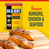 Old Bay Seasoning is shown with grilled salmon, suggesting it can season burgers, chicken, and seafood.