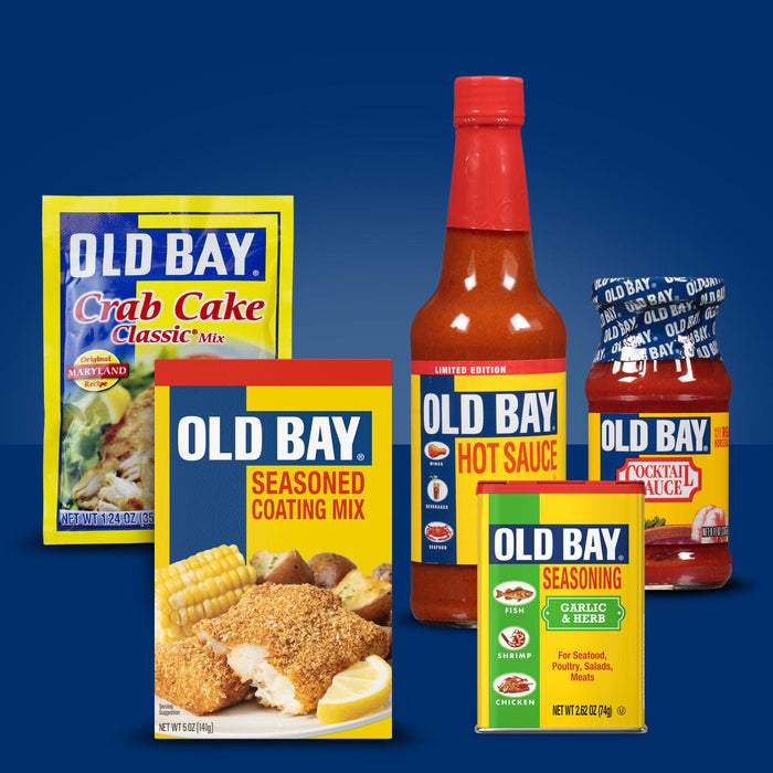 A variety of Old Bay products are displayed, including crab cake mix, seasoned coating mix, hot sauce, cocktail sauce, and seasoning.