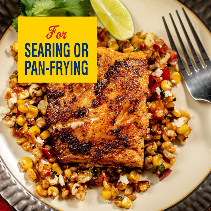 A seared piece of fish is served over a bed of corn and peppers, highlighted by a yellow banner that reads For Searing or Pan-Frying.