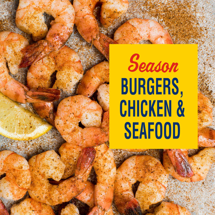 Seasoning blend for burgers, chicken, and seafood is displayed over a background of seasoned shrimp.