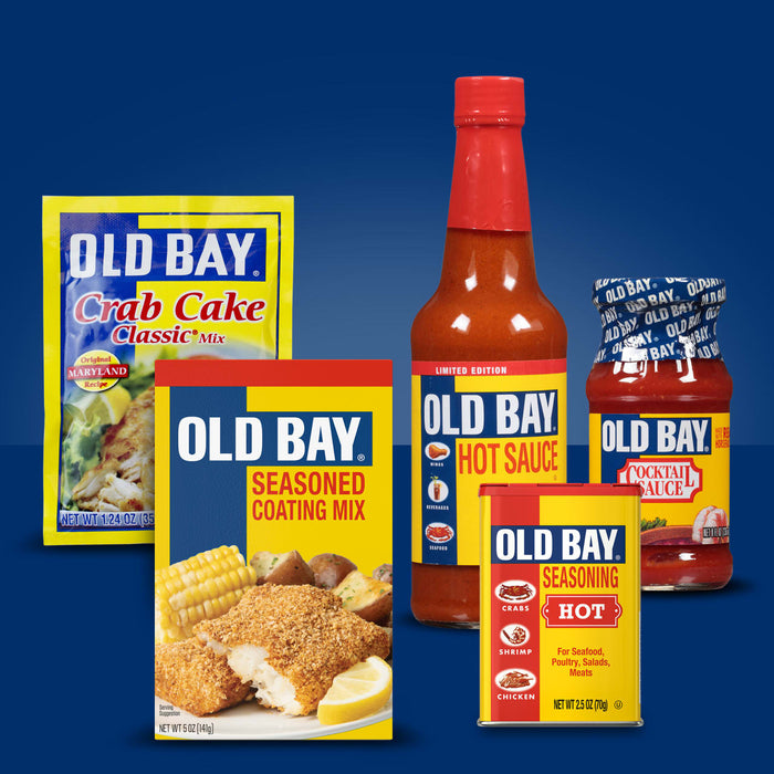 A collection of Old Bay products including crab cake mix, seasoned coating mix, hot sauce, cocktail sauce, and the original seasoning.