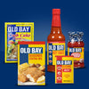 A collection of Old Bay products including crab cake mix, seasoned coating mix, hot sauce, cocktail sauce, and the original seasoning.