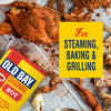 A can of Old Bay Hot Seasoning is displayed next to cooked seafood, highlighting its use for steaming, baking, and grilling.