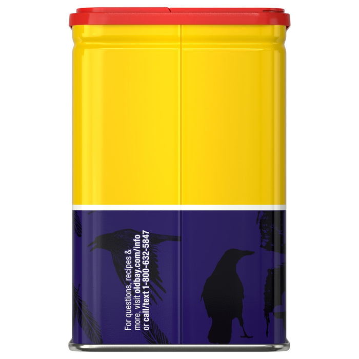 The back of a yellow and purple tin of Old Bay, 6.5 Oz features black raven silhouettes and contact information for recipes and questions.