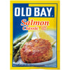 A package of Old Bay Salmon Classic Cake Mix with a serving suggestion of a salmon cake on a plate with asparagus and a lemon wedge.