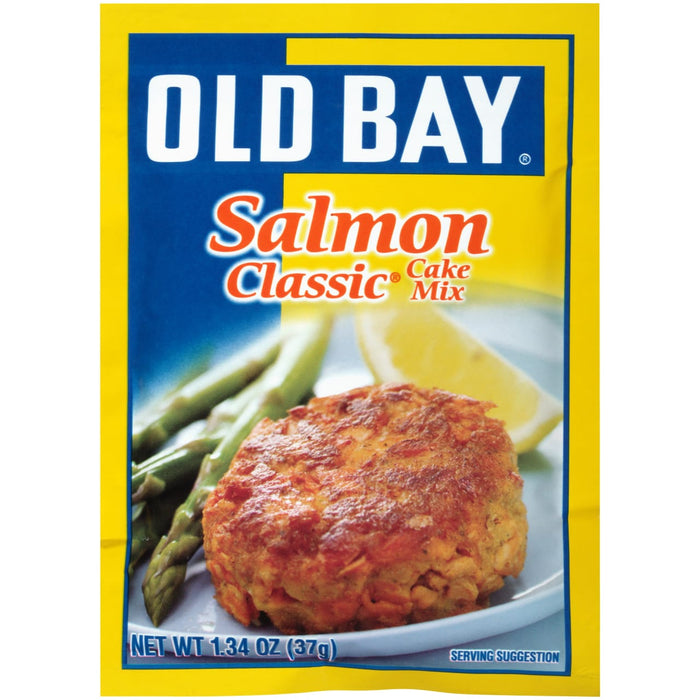 A package of Old Bay Salmon Classic Cake Mix with a serving suggestion of a salmon cake on a plate with asparagus and a lemon wedge.