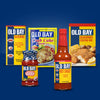 A collection of Old Bay products including seasoning, crab cake mix, hot sauce and cocktail sauce.