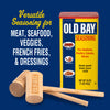 A can of Old Bay Seasoning with two wooden mallets.