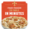 A bowl of creamy chicken pasta with the words 'From Freezer to Table in Minutes' on a red background.