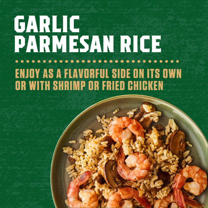 A rustic bowl filled with Zatarain'S Garlic Parmesan Long Grain White Rice, 6.9 Oz, mixed with shrimp and mushrooms, is presented as a delicious serving suggestion.