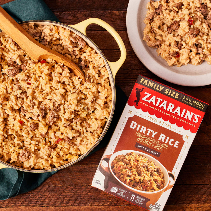 A box of Zatarain's Dirty Rice with a pot of cooked rice and a plate of rice.
