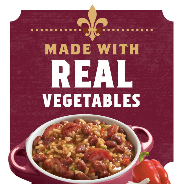 A red bowl of red beans and rice with a red bell pepper and garlic cloves next to it, with the words Made with Real Vegetables in gold and white on a maroon background.