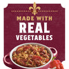 A red bowl of red beans and rice with a red bell pepper and garlic cloves next to it, with the words Made with Real Vegetables in gold and white on a maroon background.