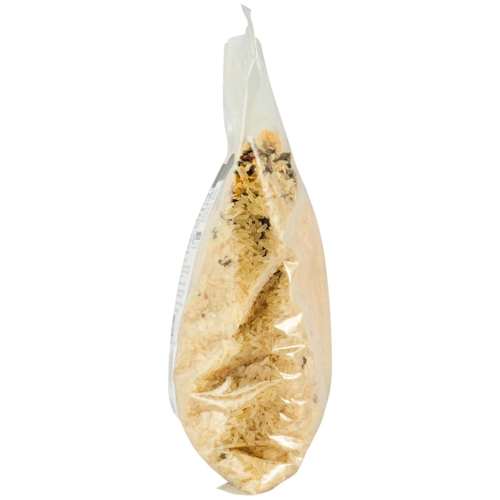 A side view of a clear plastic bag filled with Zatarains Regular Yellow Rice Mix Long Grain 51 Oz, set against a plain white background.