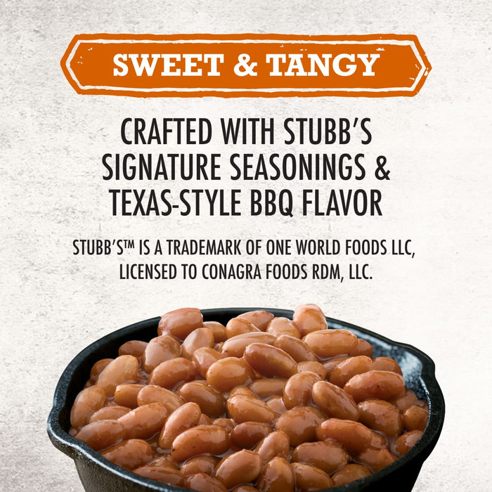 A close-up of Stubb'S Original Baked Beans, Canned Beans, 15.5 Oz., 12-Count in a cast-iron skillet, with text above highlighting the sweet and tangy Texas-style BBQ flavor.