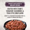 A close-up of Stubb'S Sticky Sweet Baked Beans, Canned Beans, 15.5 Oz. in a black bowl highlights the sweet molasses and brown sugar flavor.