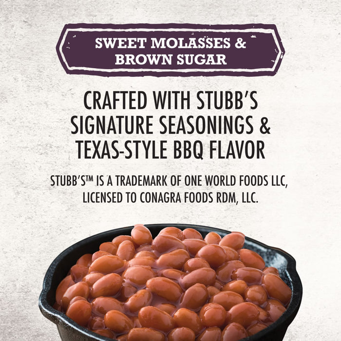 A close-up of Stubb'S Sticky Sweet Baked Beans, Canned Beans, 15.5 Oz. in a black bowl highlights the sweet molasses and brown sugar flavor.
