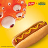 A promotional image for French'S Minion Yellow Mustard, 8 Oz, features a cartoon monster with many eyes from Illumination's Minions &amp; Monsters looking down at a hot dog topped with a squiggle of mustard.