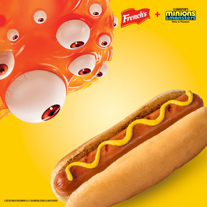 A promotional image for French'S Minion Yellow Mustard, 8 Oz, features a cartoon monster with many eyes from Illumination's Minions &amp; Monsters looking down at a hot dog topped with a squiggle of mustard.