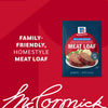 A blue packet of Mccormick Regular Meat Loaf Seasoning Mix 1.25 Oz is displayed against a red background, next to a serving suggestion of homestyle meatloaf with mashed potatoes and peas.