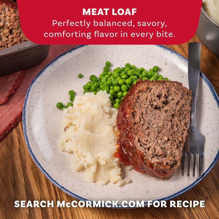 A delicious-looking plate of meatloaf, mashed potatoes, and peas is shown to highlight the comforting meal you can make with Mccormick Regular Meat Loaf Seasoning Mix 1.25 Oz.