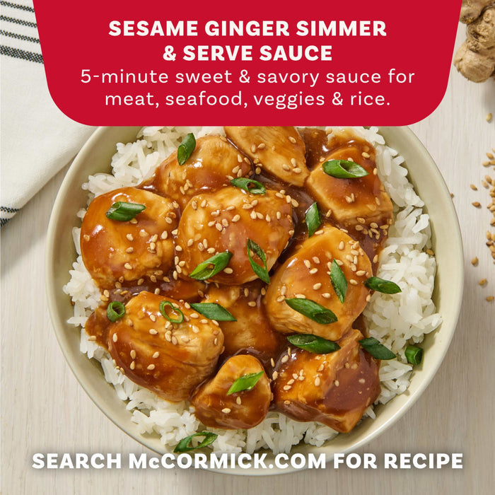 An overhead shot of a bowl of sesame ginger chicken over rice, garnished with green onions and sesame seeds, shows a serving suggestion for the Mccormick Sesame Ginger All Purpose Sauce Mix Envelope 1 Oz.