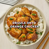 A serving suggestion for the Mccormick Sesame Ginger All Purpose Sauce Mix Envelope 1 Oz shows the prepared sauce drizzled over orange chicken and rice in a bowl.