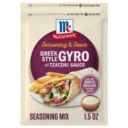 A package of Mccormick Regular Sauce And Seasoning Mix Envelope 1.5 Oz for Greek Style Gyro is displayed in front of a prepared gyro in a pita with a side of french fries.