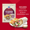 A package of Mccormick Regular Sauce And Seasoning Mix Envelope 1.5 Oz for Greek Style Gyro is displayed next to a prepared gyro with fries, showcasing a quick 15-minute meal.