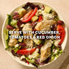 A Greek-style chicken salad with tomatoes, cucumbers, and red onion is presented in a white bowl as a serving suggestion for a meal made with Mccormick Regular Sauce And Seasoning Mix Envelope 1.5 Oz.