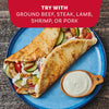 A serving suggestion for a Mccormick Regular Sauce And Seasoning Mix Envelope 1.5 Oz, showing a finished chicken gyro on a blue plate with a side of creamy sauce.