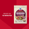 A package of Mccormick Regular Sauce And Seasoning Mix Envelope 1.37 Oz for Shawarma is shown next to a serving suggestion of a finished pita, with text highlighting it is ready in 15 minutes.