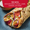 A close-up of a delicious gyro filled with seasoned meat and fresh vegetables, showing a serving suggestion for the Mccormick Regular Sauce And Seasoning Mix Envelope 1.37 Oz.