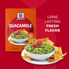 A packet of Mccormick Regular Seasoning Mix 1 Oz is displayed next to a bowl of fresh guacamole and chips to showcase its use in creating a dip with long-lasting fresh flavor.