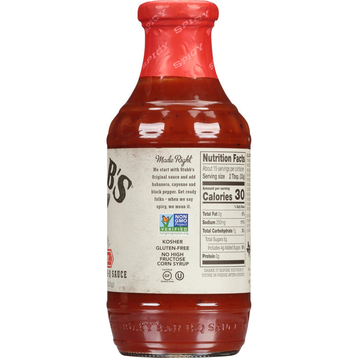 A bottle of Stubbs Spicy BBQ Sauce with nutritional information and ingredients listed on the label.