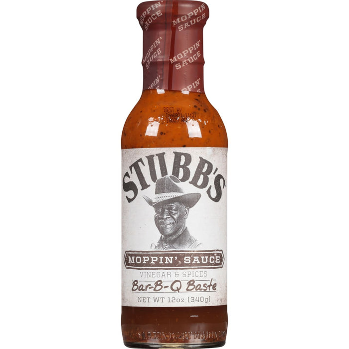 A bottle of Stubbs Moppin Sauce a vinegar and spices Bar-B-Q Baste.