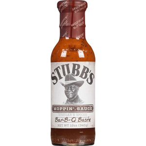 A bottle of Stubbs Moppin Sauce a vinegar and spices Bar-B-Q Baste.