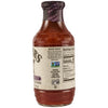 A side view of a Stubbs Sweet Barbeque Sauce Glass Bottle 18 Oz showing the nutrition facts and non-GMO certification on the label.
