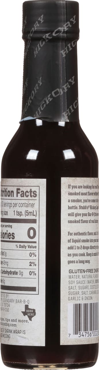 A bottle of Stubb's Hickory Liquid Smoke with nutrition facts and ingredients listed on the label.
