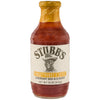 A Stubbs Sweet Honey &amp; Spice Barbeque Sauce Glass Bottle 18 Oz featuring a portrait of the founder and a yellow seal on the neck.