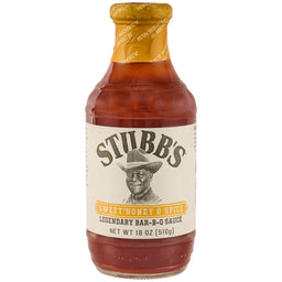 A Stubbs Sweet Honey &amp; Spice Barbeque Sauce Glass Bottle 18 Oz featuring a portrait of the founder and a yellow seal on the neck.