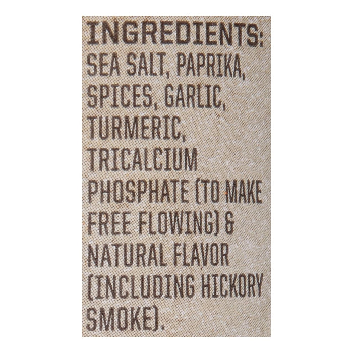 A list of ingredients for a seasoning blend, including sea salt, paprika, spices, garlic, turmeric, tricalcium phosphate, and natural hickory smoke flavor.