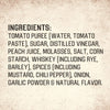 The image shows the ingredient list for a food product, including tomato puree, sugar, distilled vinegar, peach juice, molasses, salt, corn starch, whiskey, spices, onion, garlic powder, and natural flavor.