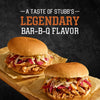 Two Stubb's Legendary Bar-B-Q sandwiches are displayed on a wooden board.