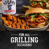 A bottle of Stubb's barbecue sauce is featured alongside a delicious grilled burger with sweet potato wedges, perfect for all grilling occasions.