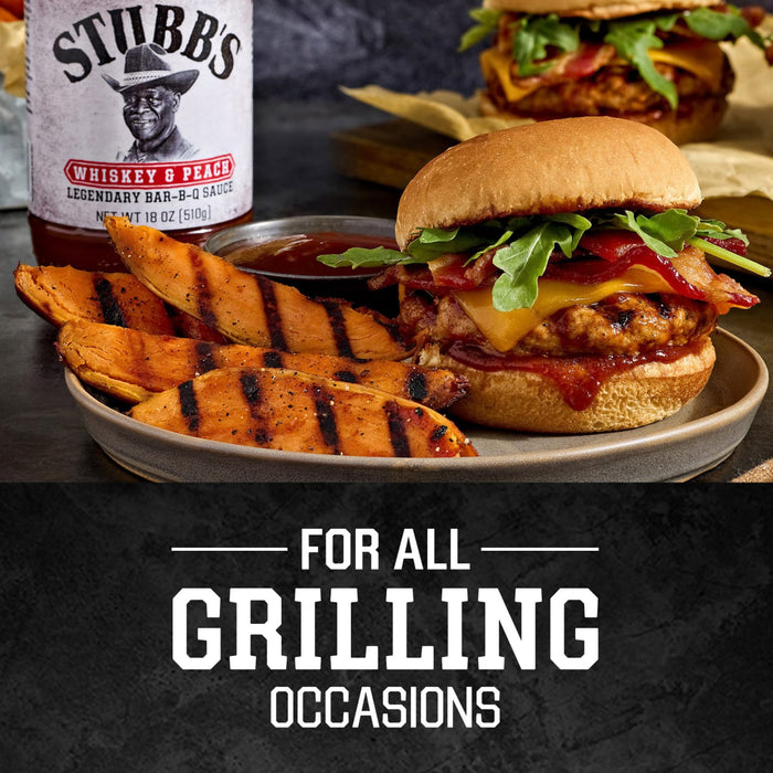 A bottle of Stubb's barbecue sauce is featured alongside a delicious grilled burger with sweet potato wedges, perfect for all grilling occasions.