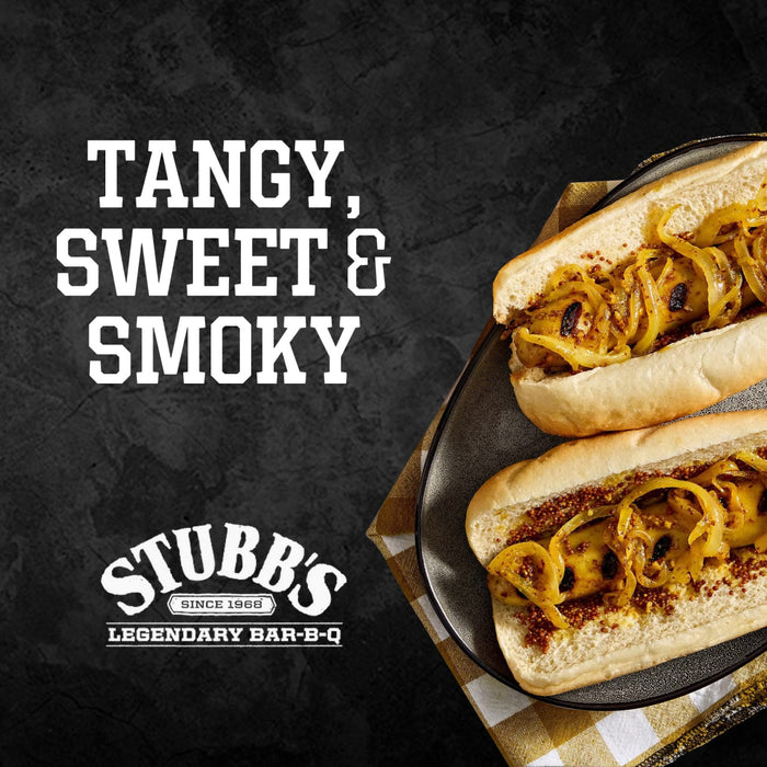A close-up of two hot dogs topped with a tangy, sweet, and smoky sauce, featuring the Stubb's Legendary Bar-B-Q logo.