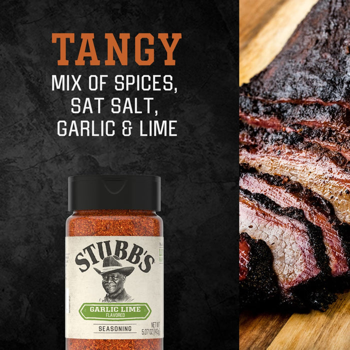 A bottle of Stubbs Grlc Lime E seasoning is displayed against a dark textured background next to a sliced smoked brisket and text describing its tangy mix of spices sea salt garlic and lime.