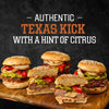 Five gourmet burgers featuring melted cheese centers and vibrant toppings are displayed on a wooden board to showcase the authentic Texas kick and hint of citrus from Stubbs Grlc Lime E.