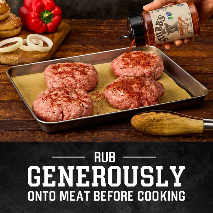 A person seasons four raw burger patties on a baking sheet with Stubbs Grlc Lime E pork rub to show how to apply it generously before cooking.